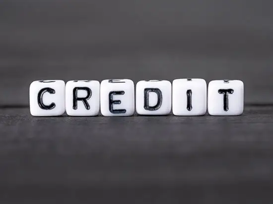 image of dice spelling the word CREDIT